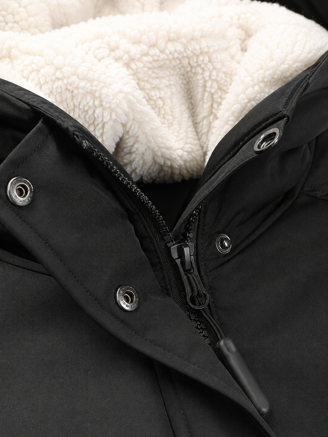 Zwarte parka jas met sherpa capuchon - detail rits